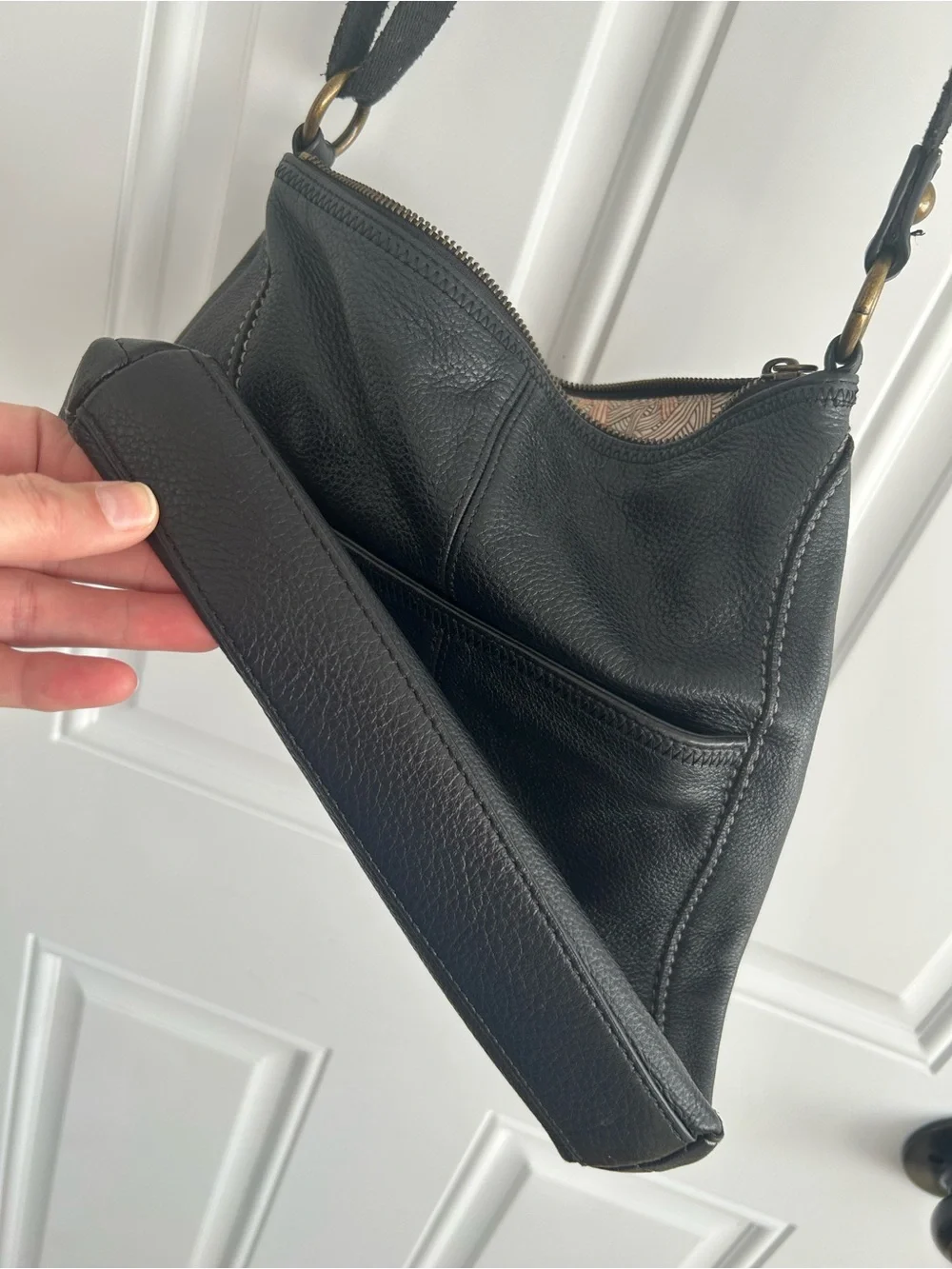 The Sac Iris Black Pebbled Leather Crossbody Bag Adjustable Strap Brass Hardware